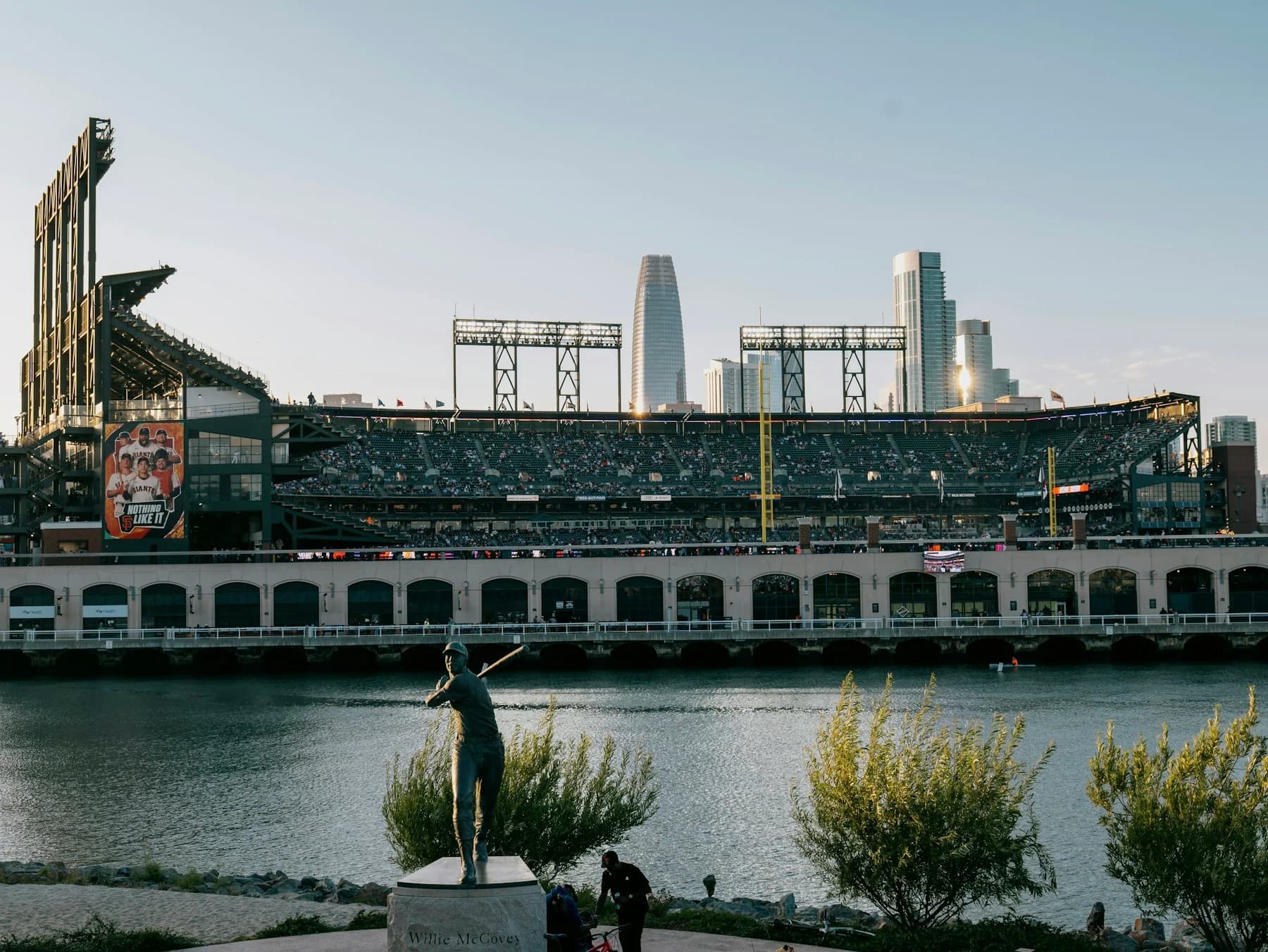 Oracle Park beside McCovey Cove with the San Francisco skyline behind the stands