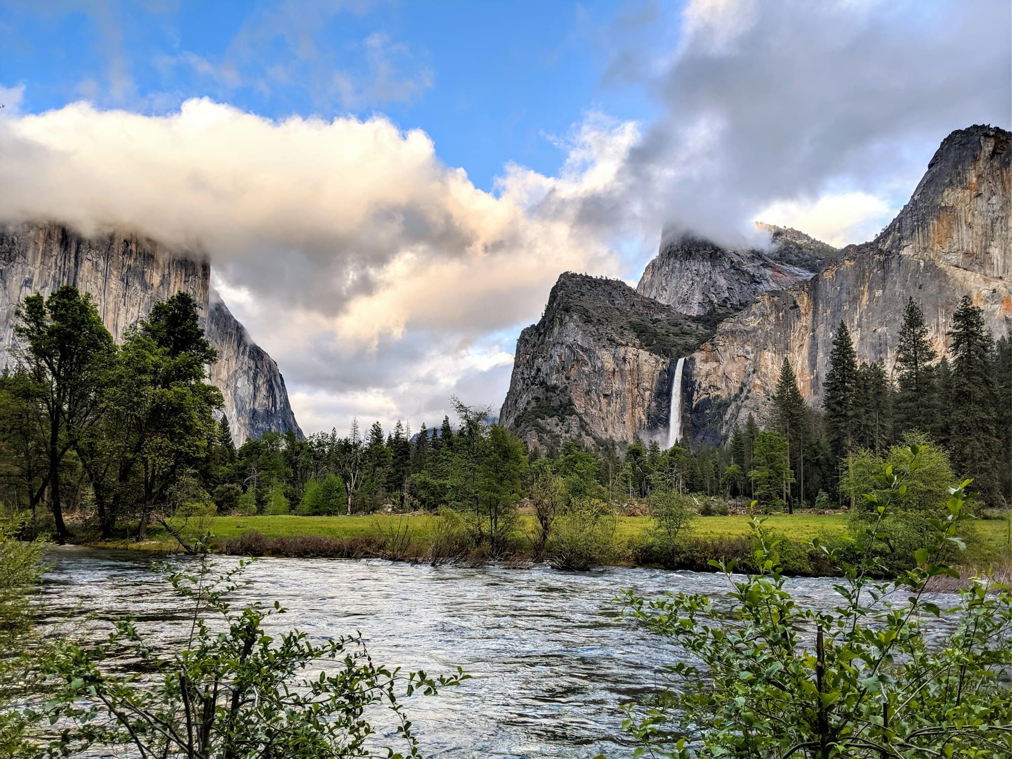 Merced River, trees and granite cliffs in Yosemite Valley